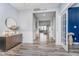 Open foyer with hardwood floors, neutral walls and decorative accents at 12634 Mustard Seed Ct, Fishers, IN 46038