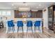 Beautiful kitchen with hardwood floors, center island and modern lighting at 12634 Mustard Seed Ct, Fishers, IN 46038