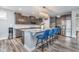 Gourmet kitchen with hardwood floors, island seating and stainless steel appliances at 12634 Mustard Seed Ct, Fishers, IN 46038