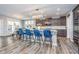 Stylish kitchen with hardwood floors, center island and modern pendant lighting at 12634 Mustard Seed Ct, Fishers, IN 46038