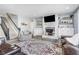 Inviting living room featuring a staircase, fireplace, built-ins, and a comfortable seating arrangement at 12634 Mustard Seed Ct, Fishers, IN 46038