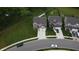 Aerial view of a neighborhood showcasing well-manicured lawns and tree-lined streets at 1336 Danielle Rd, Lebanon, IN 46052
