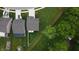 Bird's-eye view of a home with a well-kept lawn, white privacy fence, and mature trees at 1336 Danielle Rd, Lebanon, IN 46052