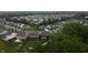 Aerial view of a neighborhood showing well-maintained homes with mature trees and green spaces at 1336 Danielle Rd, Lebanon, IN 46052
