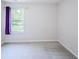 Bright bedroom with neutral carpet, large window, and purple curtains offers a cozy space at 1336 Danielle Rd, Lebanon, IN 46052