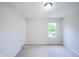 Bright bedroom with plush carpeting, a window offering natural light and a view, and fresh, neutral paint at 1336 Danielle Rd, Lebanon, IN 46052