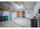 Spacious garage with a white garage door and plenty of storage space for tools and equipment at 1336 Danielle Rd, Lebanon, IN 46052