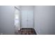 Hallway features hardwood flooring, neutral paint, and a closet with bi-fold doors at 1336 Danielle Rd, Lebanon, IN 46052