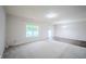 Bright and airy living room with plush carpeting, hardwood floors, and a sliding glass door at 1336 Danielle Rd, Lebanon, IN 46052