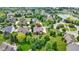 Aerial view of a neighborhood with mature trees and landscaping near a cul-de-sac at 13624 Alston Dr, Fishers, IN 46037