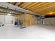 Unfinished basement with exposed wood ceiling and concrete flooring, awaiting personalization at 13624 Alston Dr, Fishers, IN 46037