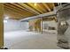 Unfinished basement with concrete walls and exposed wood ceiling awaiting personalization at 13624 Alston Dr, Fishers, IN 46037