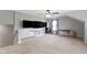 Carpeted bonus room with multiple TVs, a ceiling fan and a desk at 13624 Alston Dr, Fishers, IN 46037