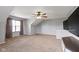 Spacious bonus room with a ceiling fan and a window for natural light at 13624 Alston Dr, Fishers, IN 46037