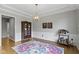 Bright dining room with hardwood floors, elegant chandelier, and classic wainscoting for a formal atmosphere at 13624 Alston Dr, Fishers, IN 46037