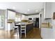 Spacious kitchen with a central island, stainless steel appliances, white cabinets, and hardwood floors at 13624 Alston Dr, Fishers, IN 46037
