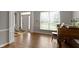 Inviting foyer with hardwood floors, a bright window, decorative columns, and a view of the entrance at 13624 Alston Dr, Fishers, IN 46037