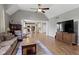 Open-concept living room flowing into a modern kitchen with an eating bar at 13624 Alston Dr, Fishers, IN 46037