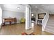 Inviting living room with hardwood floors, decorative columns, and an abundance of natural light at 13624 Alston Dr, Fishers, IN 46037