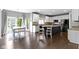 Inviting open-concept living space with a kitchen, dining area, and access to the outdoors via sliding glass doors at 13624 Alston Dr, Fishers, IN 46037