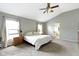 Spacious main bedroom with ensuite bathroom and ceiling fan at 13624 Alston Dr, Fishers, IN 46037