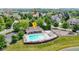 Community pool and recreation area with seating, pool house and playground at 13624 Alston Dr, Fishers, IN 46037
