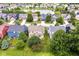 Aerial view of homes, mature trees and a serene pond at 13700 Stanford Dr, Carmel, IN 46074