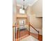 Bright and airy foyer with hardwood floors, wainscoting, and a stunning chandelier at 13700 Stanford Dr, Carmel, IN 46074