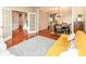 Open-concept living space with hardwood floors, a glimpse of the dining area, and easy access to the kitchen at 13700 Stanford Dr, Carmel, IN 46074