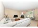 Inviting living room featuring a fireplace, comfortable seating and natural light at 13700 Stanford Dr, Carmel, IN 46074