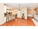 Open-concept living space featuring kitchen with island and dining room at 13700 Stanford Dr, Carmel, IN 46074
