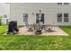 View of the patio with grill and table with chairs in the backyard of this home at 14523 Lee Stewart Ln, Fishers, IN 46038