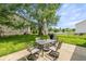 Enjoy outdoor dining on the patio set located in the fenced backyard with mature tree at 14523 Lee Stewart Ln, Fishers, IN 46038