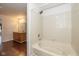 Bright bathroom featuring white tile and hardwood floors at 14523 Lee Stewart Ln, Fishers, IN 46038