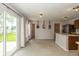 Open kitchen area with sliding glass doors to the yard and views of the adjacent kitchen space at 14523 Lee Stewart Ln, Fishers, IN 46038