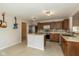 Well-appointed kitchen features tile floors, stainless steel appliances, and spacious countertops for meal preparation at 14523 Lee Stewart Ln, Fishers, IN 46038
