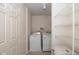 Bright laundry room featuring a washer, dryer, and shelving at 14523 Lee Stewart Ln, Fishers, IN 46038