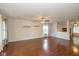Spacious living room featuring hardwood floors, natural light, and seamless flow to the adjacent rooms at 14523 Lee Stewart Ln, Fishers, IN 46038