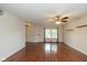 Bright and airy living room with hardwood floors and large windows, perfect for entertaining or relaxing at 14523 Lee Stewart Ln, Fishers, IN 46038