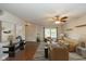 Staged living room with hardwood floors, cozy seating arrangement, and natural light from the window at 14523 Lee Stewart Ln, Fishers, IN 46038