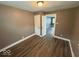 Cozy bedroom with neutral paint, updated flooring, and a closet at 1521 N Tacoma Ave, Indianapolis, IN 46201