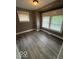Cozy bedroom with neutral paint, hardwood floors, and lots of natural light at 1521 N Tacoma Ave, Indianapolis, IN 46201