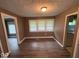The dining area has hardwood floors and multiple windows at 1521 N Tacoma Ave, Indianapolis, IN 46201