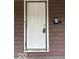The front door of the house has a white door and a modern keypad entry system at 1521 N Tacoma Ave, Indianapolis, IN 46201