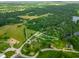 Aerial view showcases property boundaries surrounded by lush trees, highlighting the home's secluded location at 155 Hoover Dr, , IN 46164