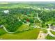 An aerial view of a home denoted with a red pin, situated in a lush, tree-filled landscape at 155 Hoover Dr, , IN 46164