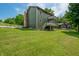 Exterior view of the home featuring upper level balconies with a spacious backyard at 155 Hoover Dr, , IN 46164