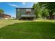 Large green yard with a walk out deck on both the first and second levels at 155 Hoover Dr, , IN 46164