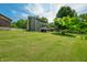 Spacious backyard with large mature trees and a detached garage at 155 Hoover Dr, , IN 46164