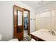 This bathroom features wood-look flooring, vanity sink, shower tub and walk-in closet at 155 Hoover Dr, , IN 46164